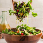 Taking a large serving of Italian Chopped Salad.