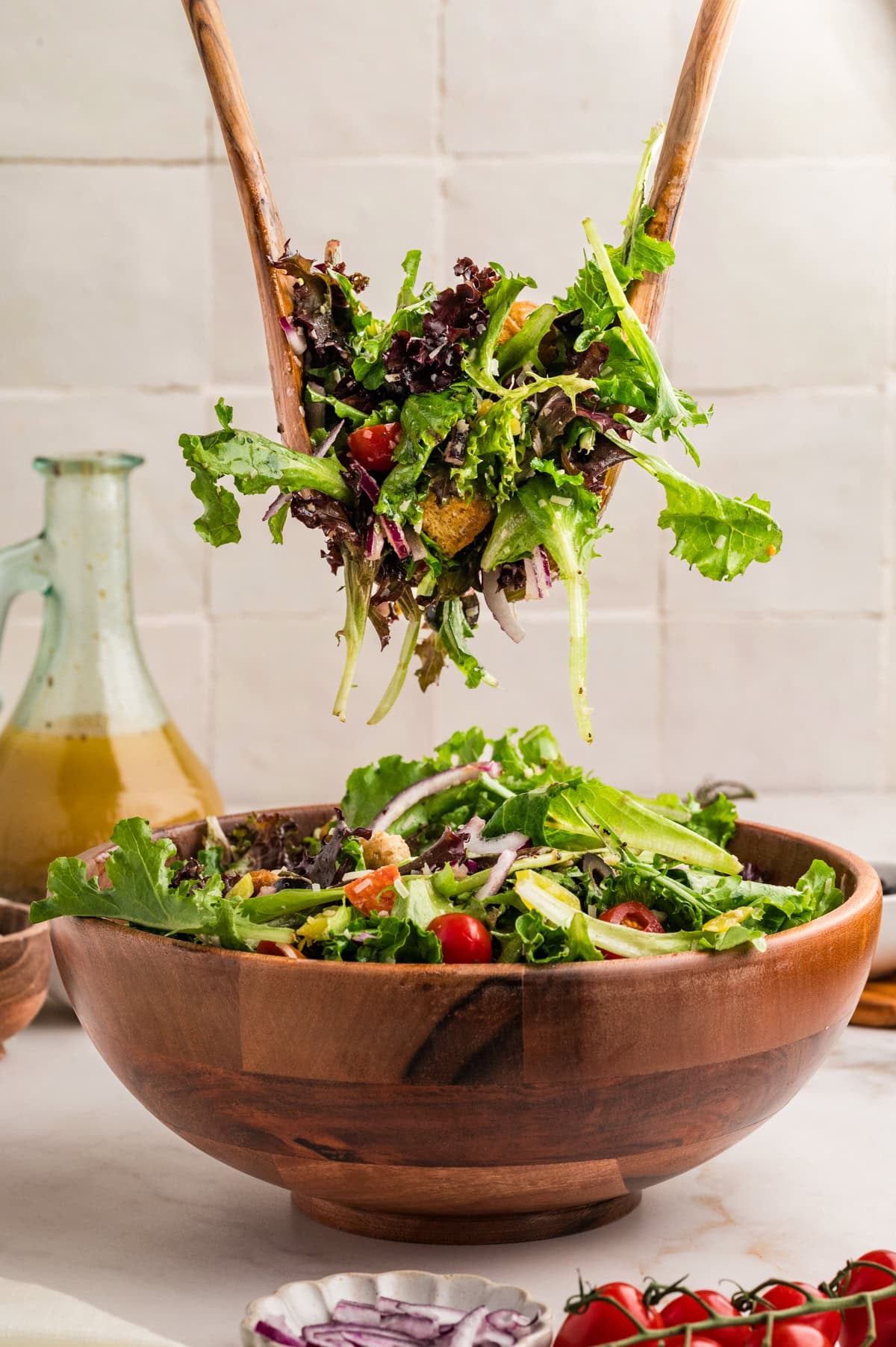 An Italian Chopped Salad adds a lot of bold flavor to any meal, but also it is healthy and delicious. This salad goes with so many mains you will want to make it again and again. Taking a large serving of Italian Chopped Salad.