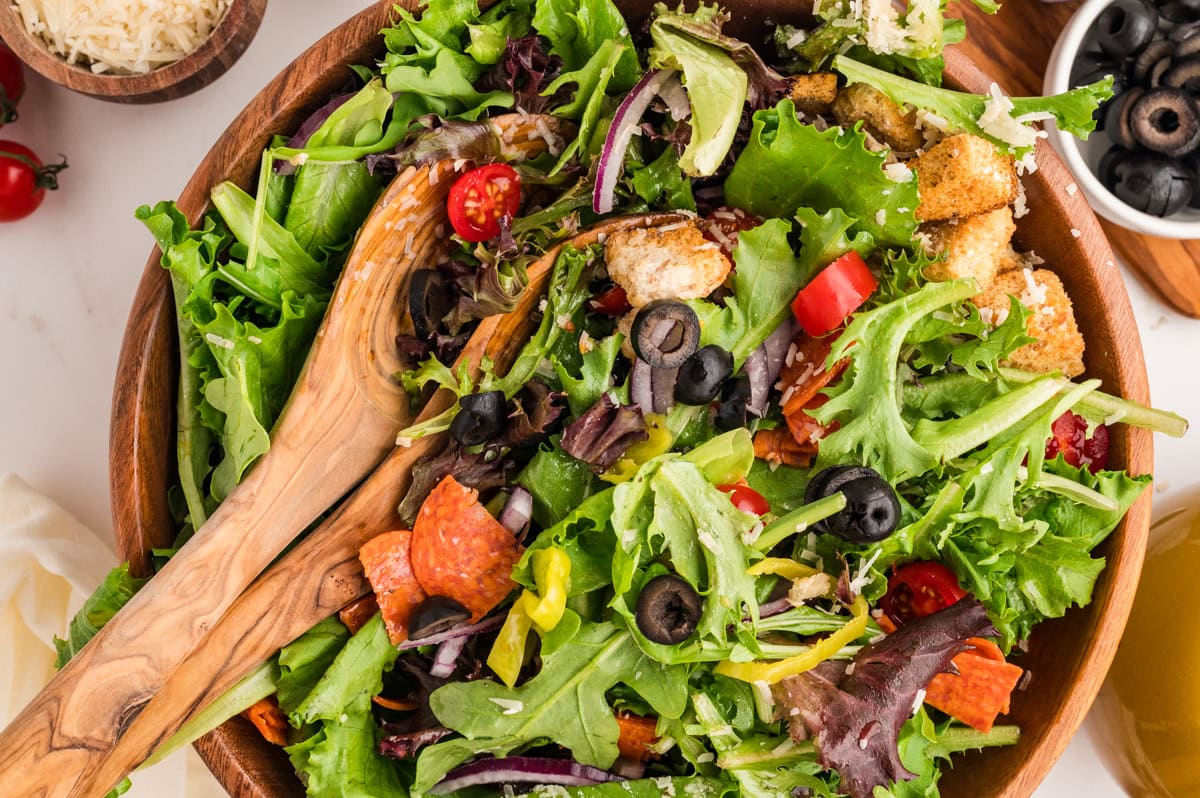 An Italian Chopped Salad adds a lot of bold flavor to any meal, but also it is healthy and delicious. This salad goes with so many mains you will want to make it again and again. Overhead horizontal of the salad.