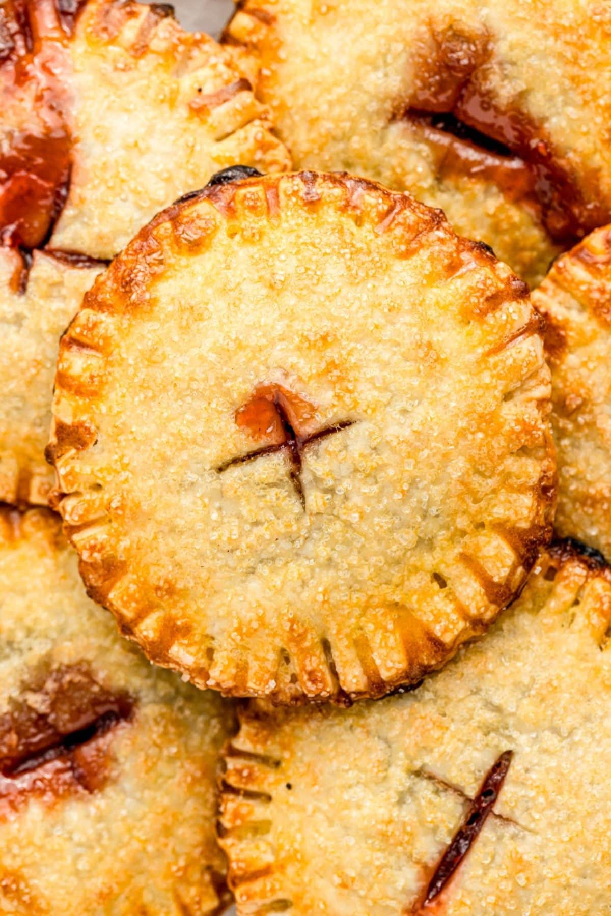 Get outside and enjoy the day with these 50 Picnic Basket Essentials. There is something for everyone to pack the perfect picnic and enjoy family time and the great outdoors. Fruit hand pies on a plate.