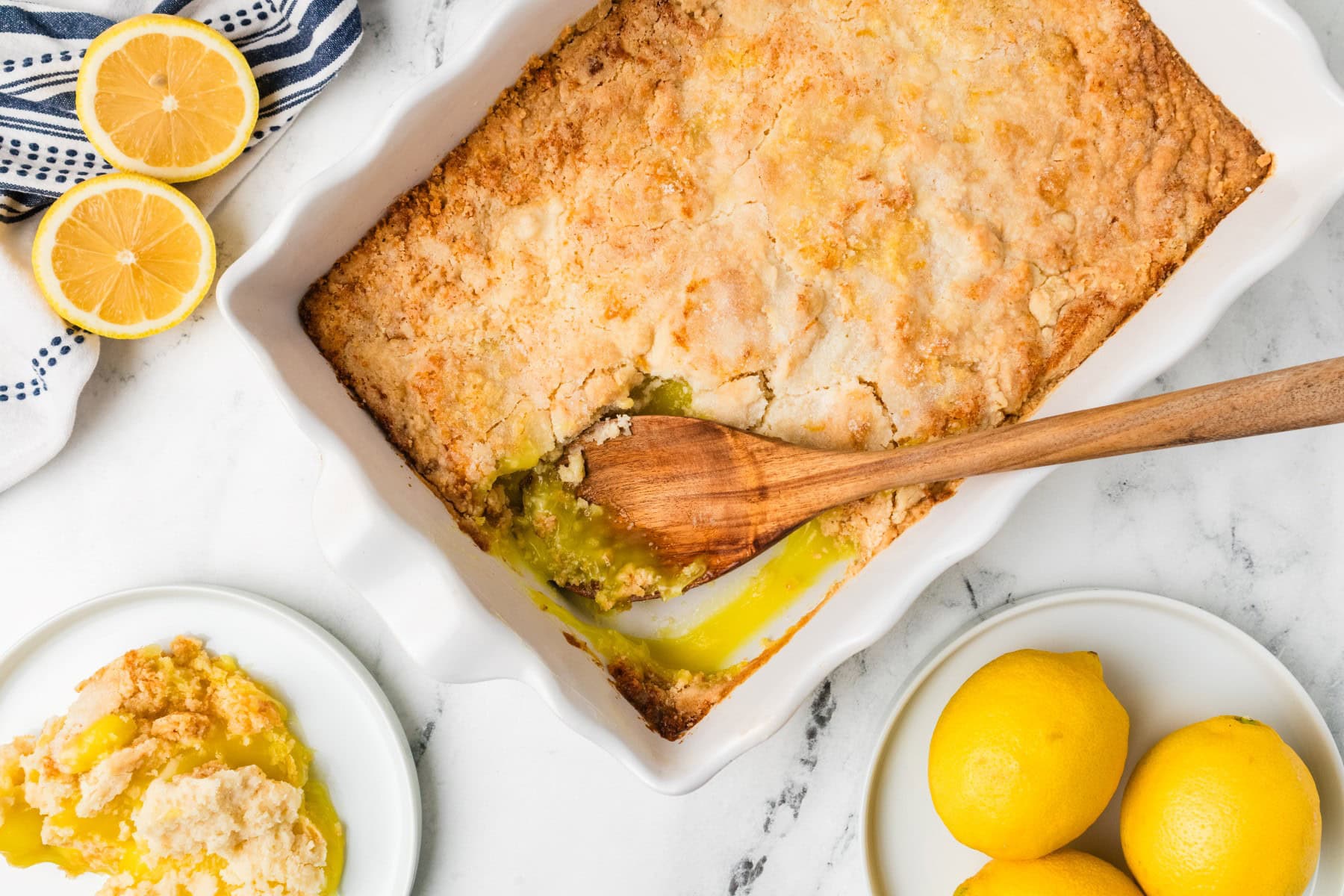 Need a quick and easy recipe? This Lemon Dump Cake is not only easy but delicious. It transports well, making a great potluck offering, and is summery and bright. Lemon lovers will be thrilled. Overhead shot of Lemon Dump Cake.