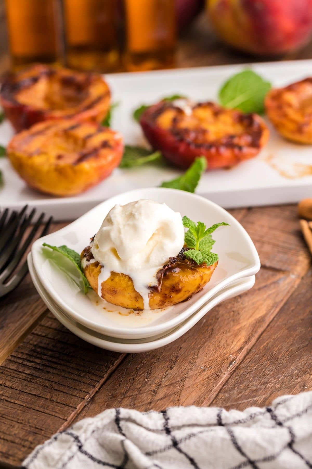 Grilled peach topping with vanilla ice cream.