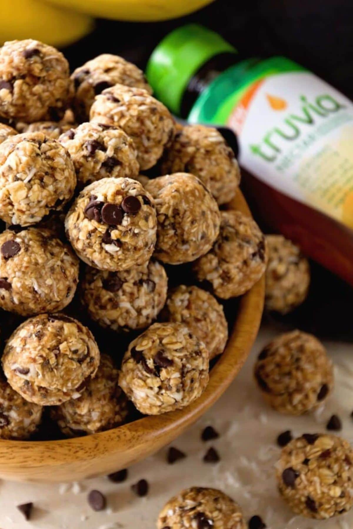 Get outside and enjoy the day with these 50 Picnic Basket Essentials. There is something for everyone to pack the perfect picnic and enjoy family time and the great outdoors. Wooden bowl full of no bake energy balls.