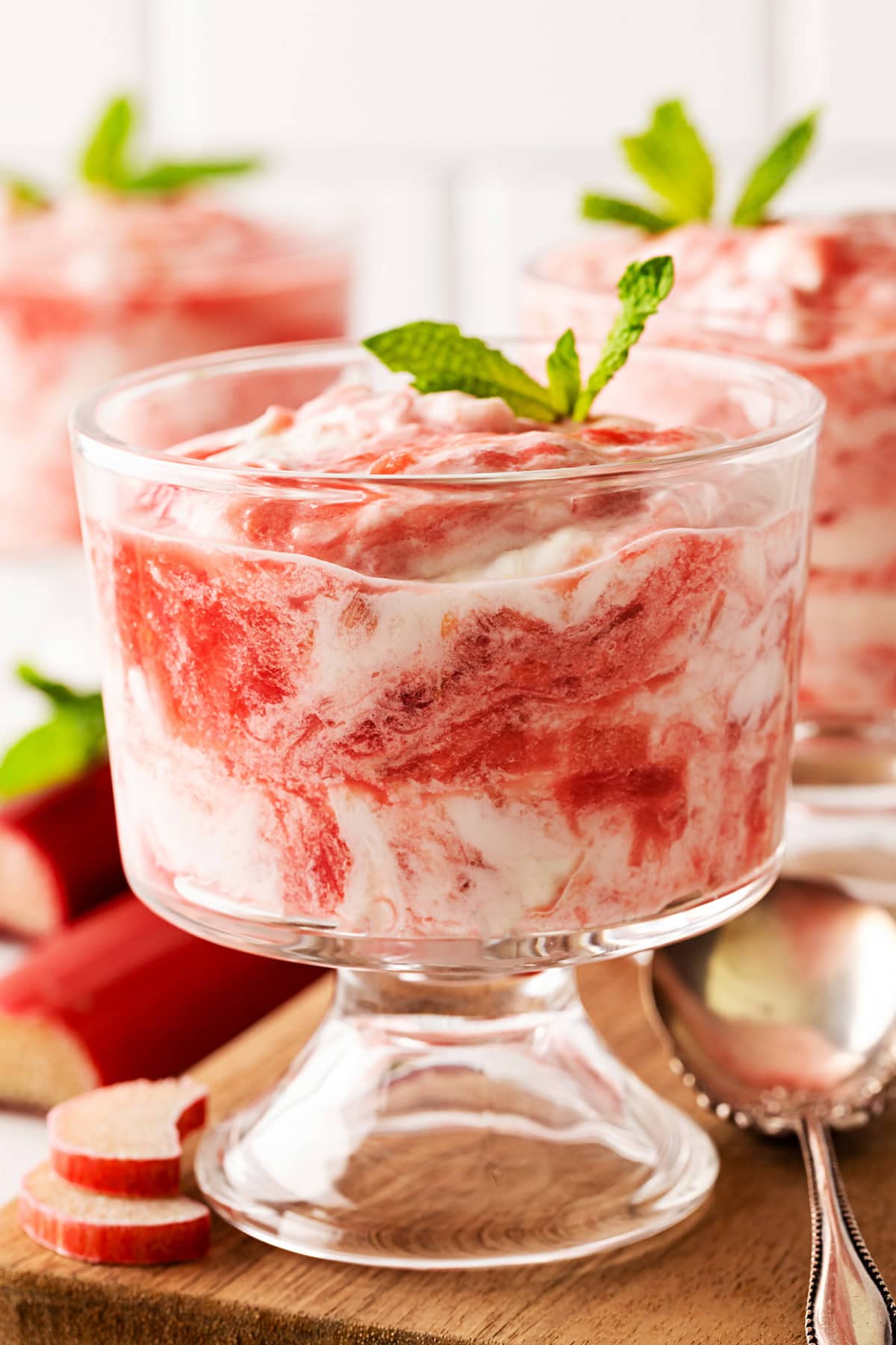 A delightful Rhubarb Fool is easy to make yet offers an elegant dessert. It is perfect after a BBQ in the spring and summer, as it is light as a cloud. Rhubarb Fool in small glasses.