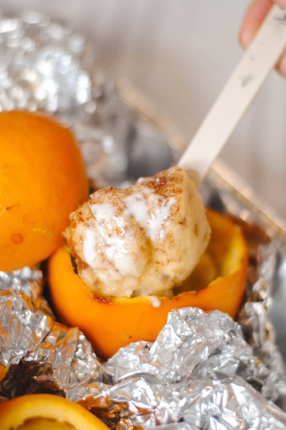Orange filled with cinnamon roll.