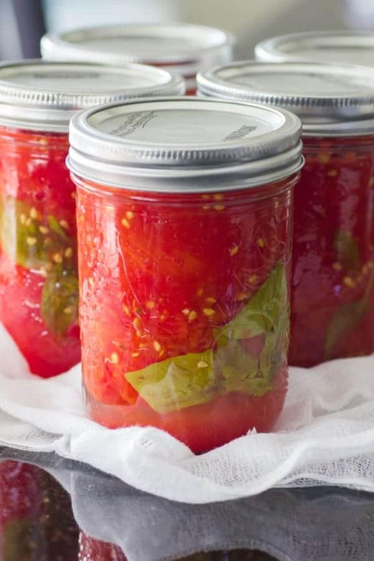 Small jar of home canned tomatoes.