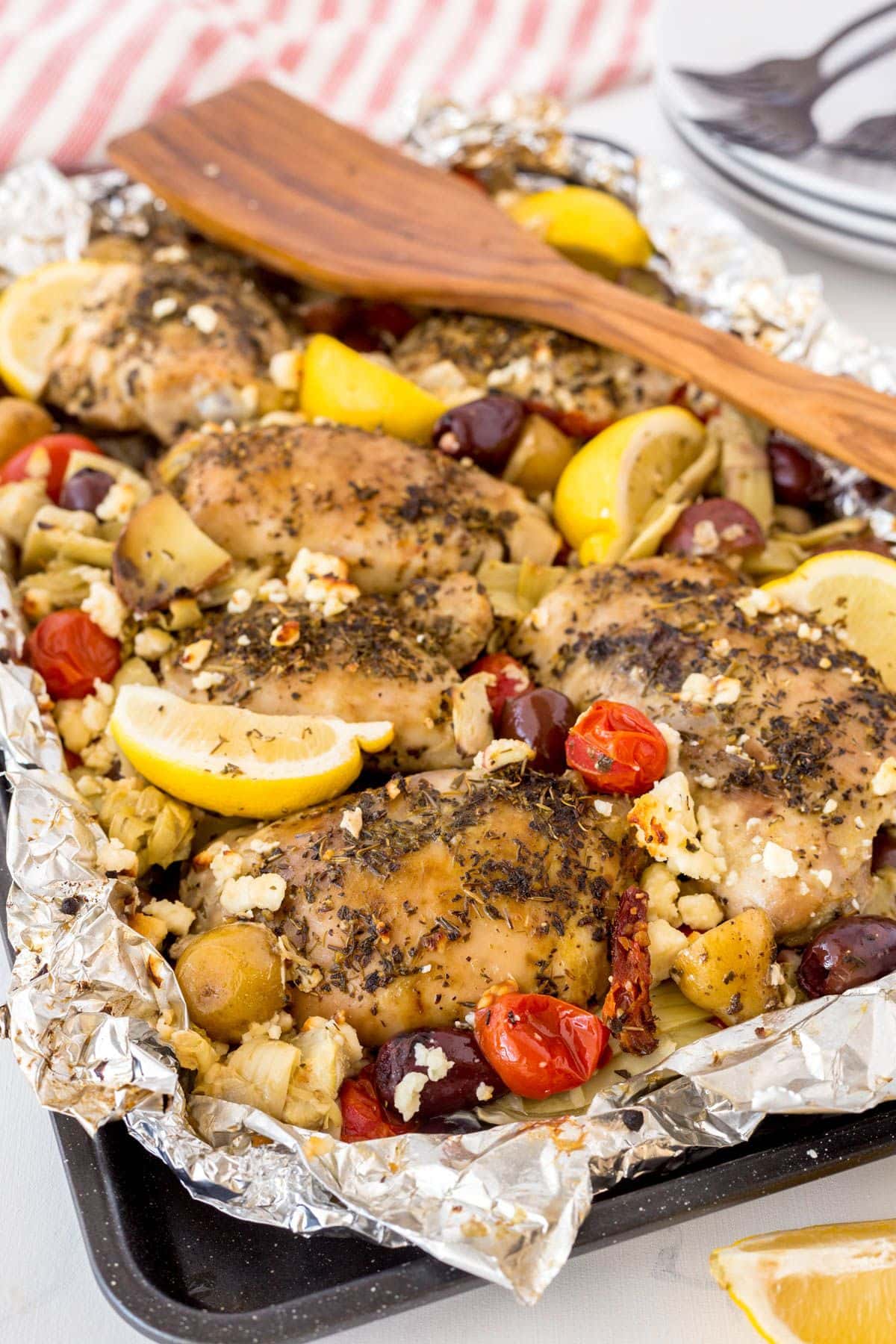 Are you enjoying the great outdoors this summer and wondering what to eat? Try some of these 20 Awesome Campfire Recipes!! Chicken and vegetables in baking dish.