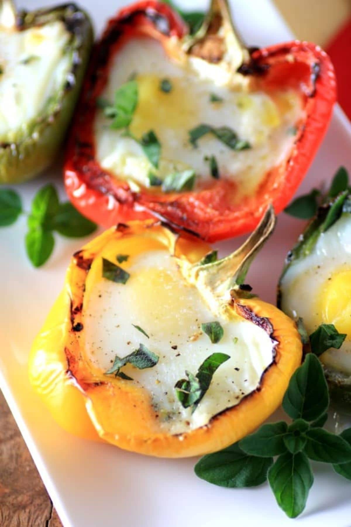 Are you enjoying the great outdoors this summer and wondering what to eat? Try some of these 20 Awesome Campfire Recipes!! Peppers stuffed with cooked eggs.