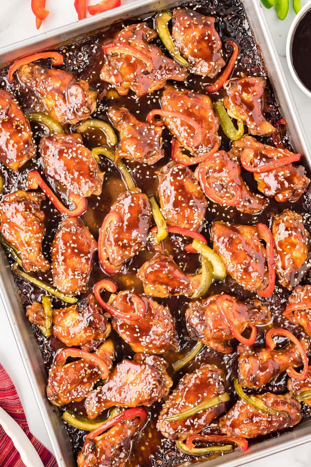 Baking sheet full of asian wings.