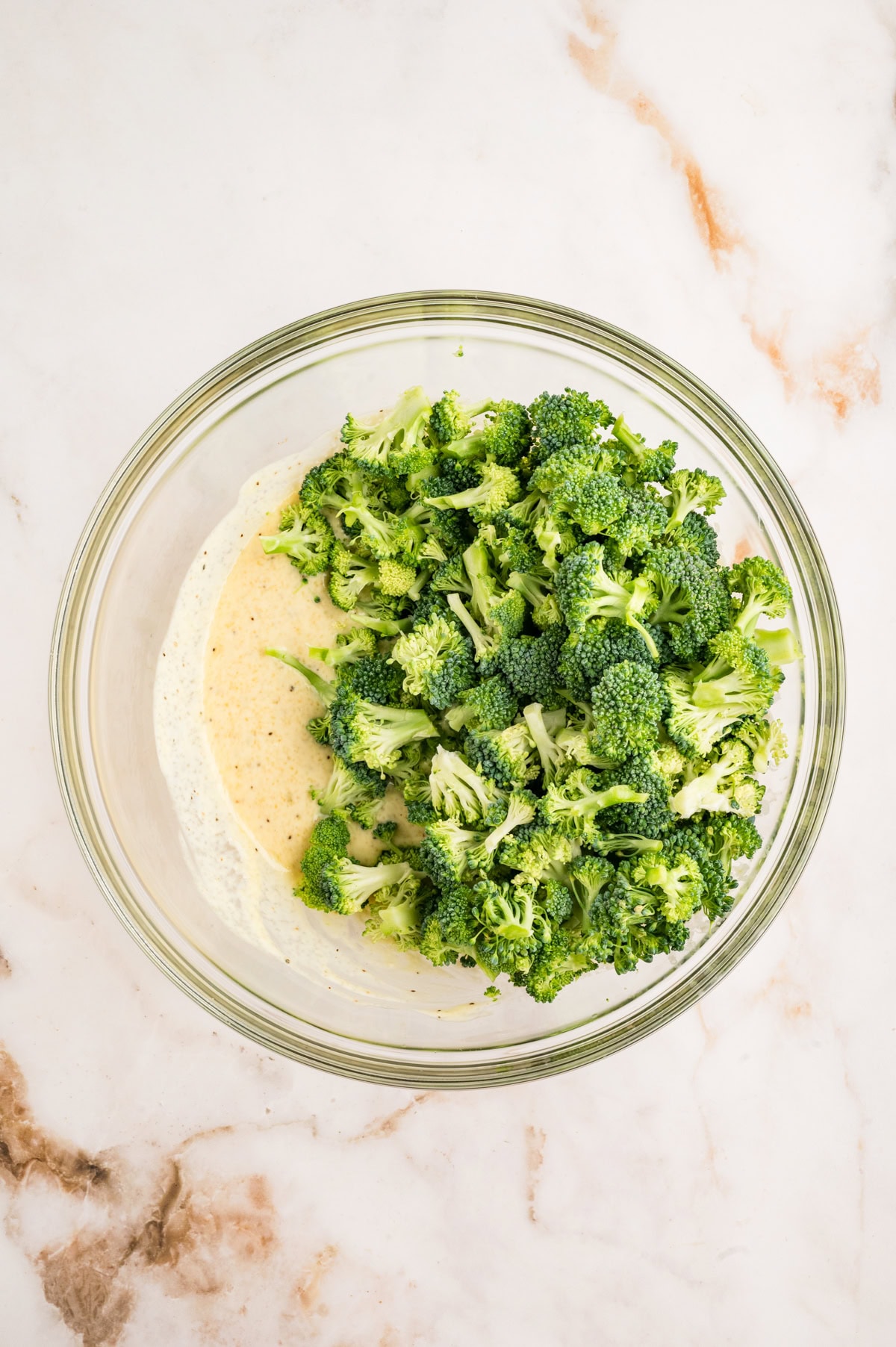This Broccoli Salad is a keeper that you will want to bring out on a constant rotation. It is perfect for a summer BBQ, picnic or really at any time of the year. Broccoli added to dressing.