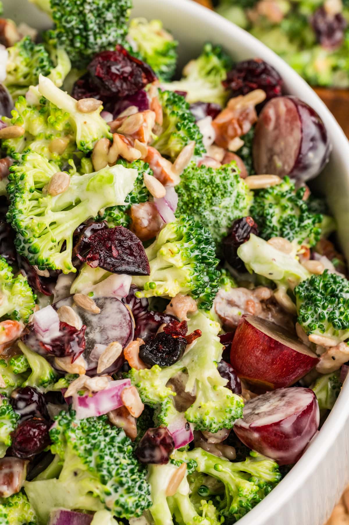 This Broccoli Salad is a keeper that you will want to bring out on a constant rotation. It is perfect for a summer BBQ, picnic or really at any time of the year. Overhead close-up of Broccoli Salad.