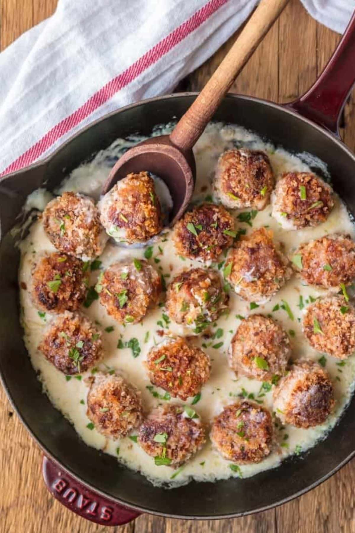 Chicken cordon bleu meatballs in a skillet.