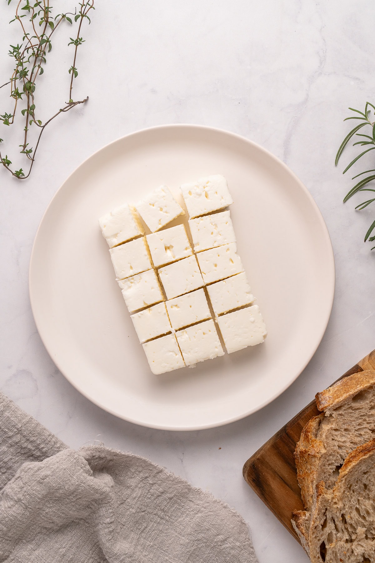 Marinated Feta is a great appetizer on its own or added to a charcuterie or Mediterranean platter. It is also amazing with a summer salad or Greek salad. Cubed feta cheese.