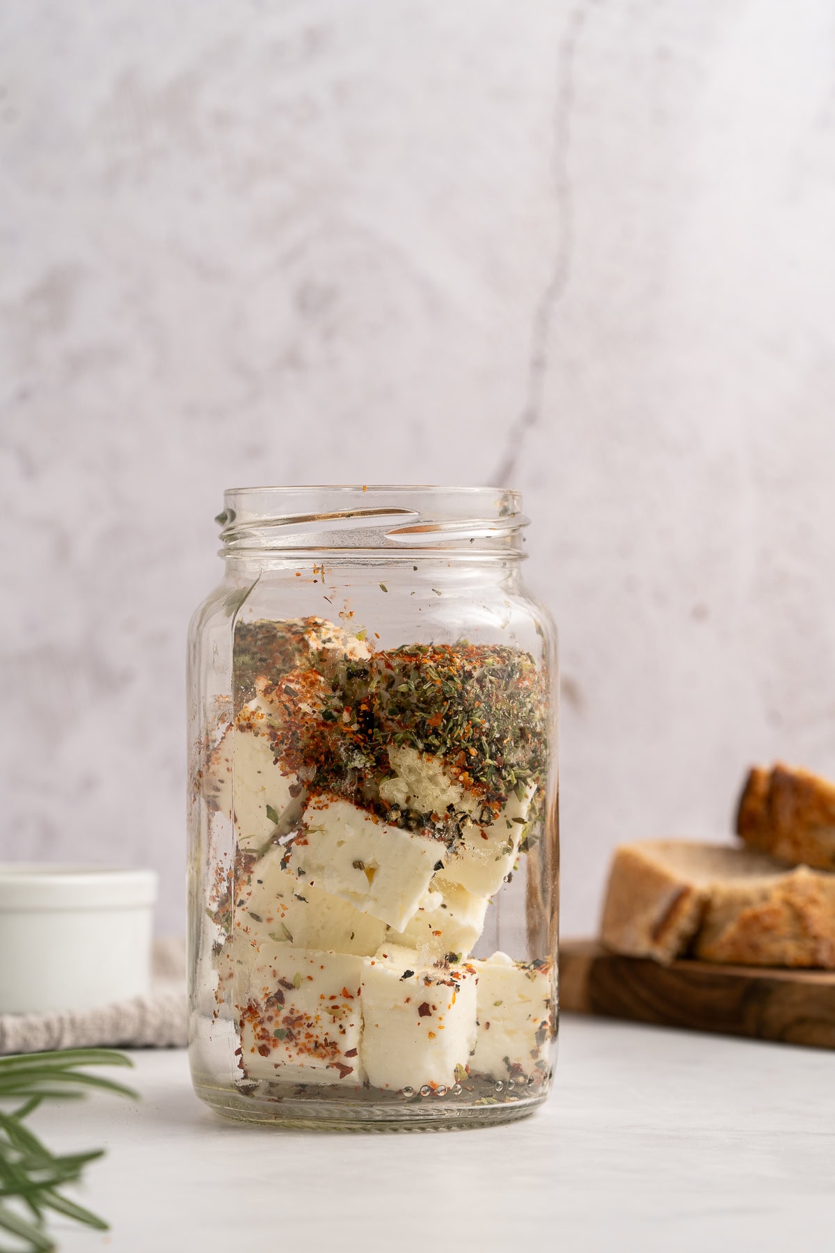 Marinated Feta is a great appetizer on its own or added to a charcuterie or Mediterranean platter. It is also amazing with a summer salad or Greek salad. Adding seasoning to the marinade.