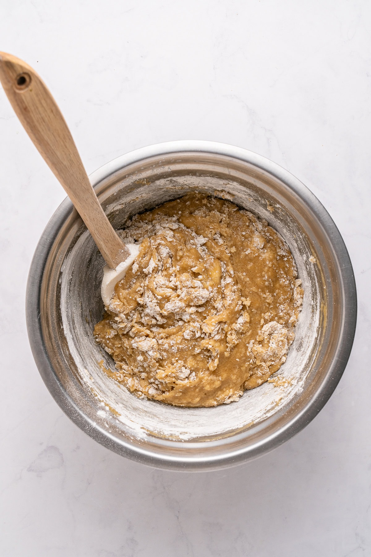 Make summer even more fun with these Cookie Ice Cream Sandwiches. These are a great make-ahead treat that is ready and waiting for you in the freezer for any time of the day. Mixing in dry ingredients.