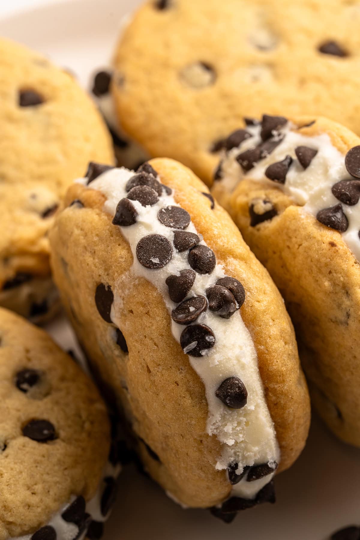 Make summer even more fun with these Cookie Ice Cream Sandwiches. These are a great make-ahead treat that is ready and waiting for you in the freezer for any time of the day. Frozen cookie ice cream sandwich.