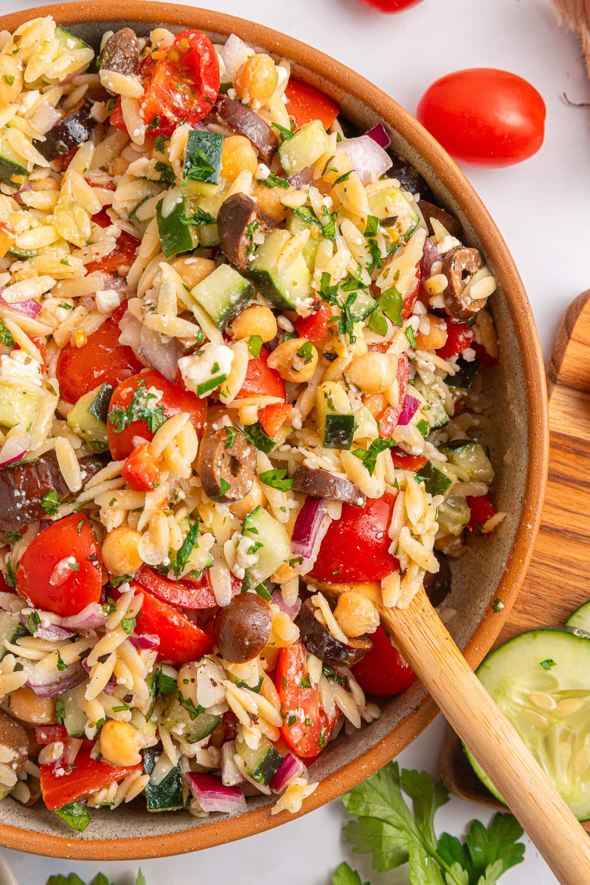 Get outside and enjoy the day with these 50 Picnic Basket Essentials. There is something for everyone to pack the perfect picnic and enjoy family time and the great outdoors. Overhead of a Greek Pasta Salad.