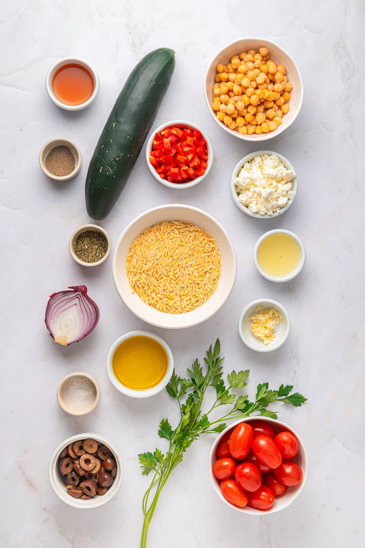 Another winner of a summer salad is this Greek Orzo Pasta Salad. It is easily portable, making it great for a picnic, BBQ or any gathering. It is hearty and healthy and full of flavors! Greek orzo salad ingredients.