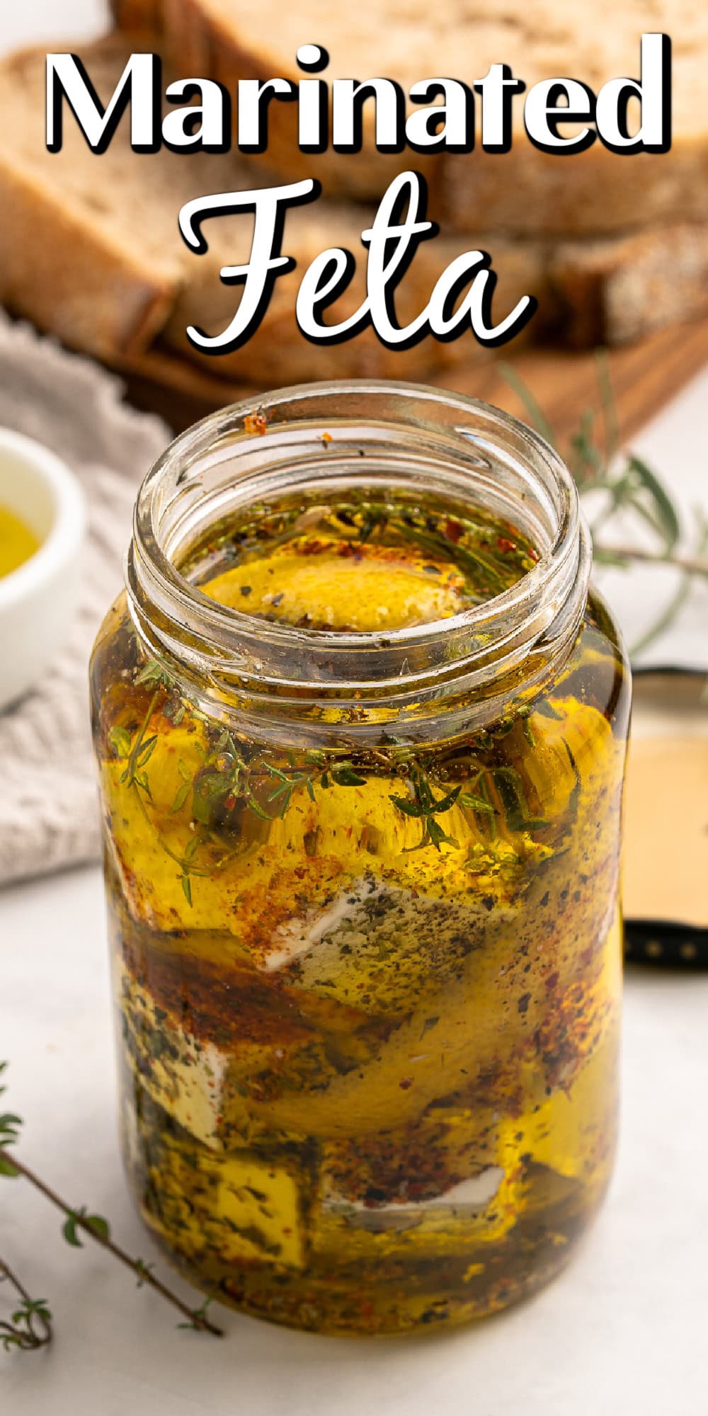 Marinated Feta is a great appetizer on its own or added to a charcuterie or Mediterranean platter. It is also amazing with a summer salad or Greek salad. Marinated Feta Pin.
