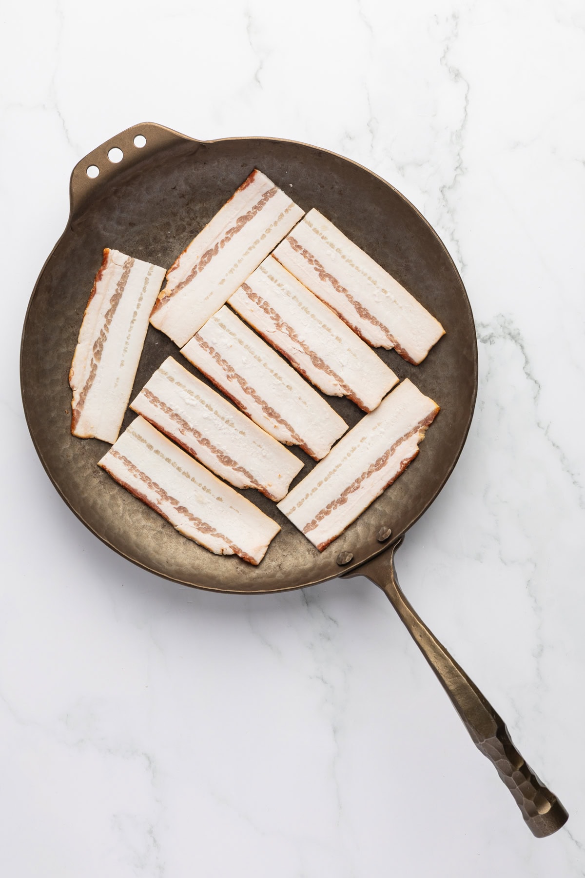 Bacon in a skillet. 