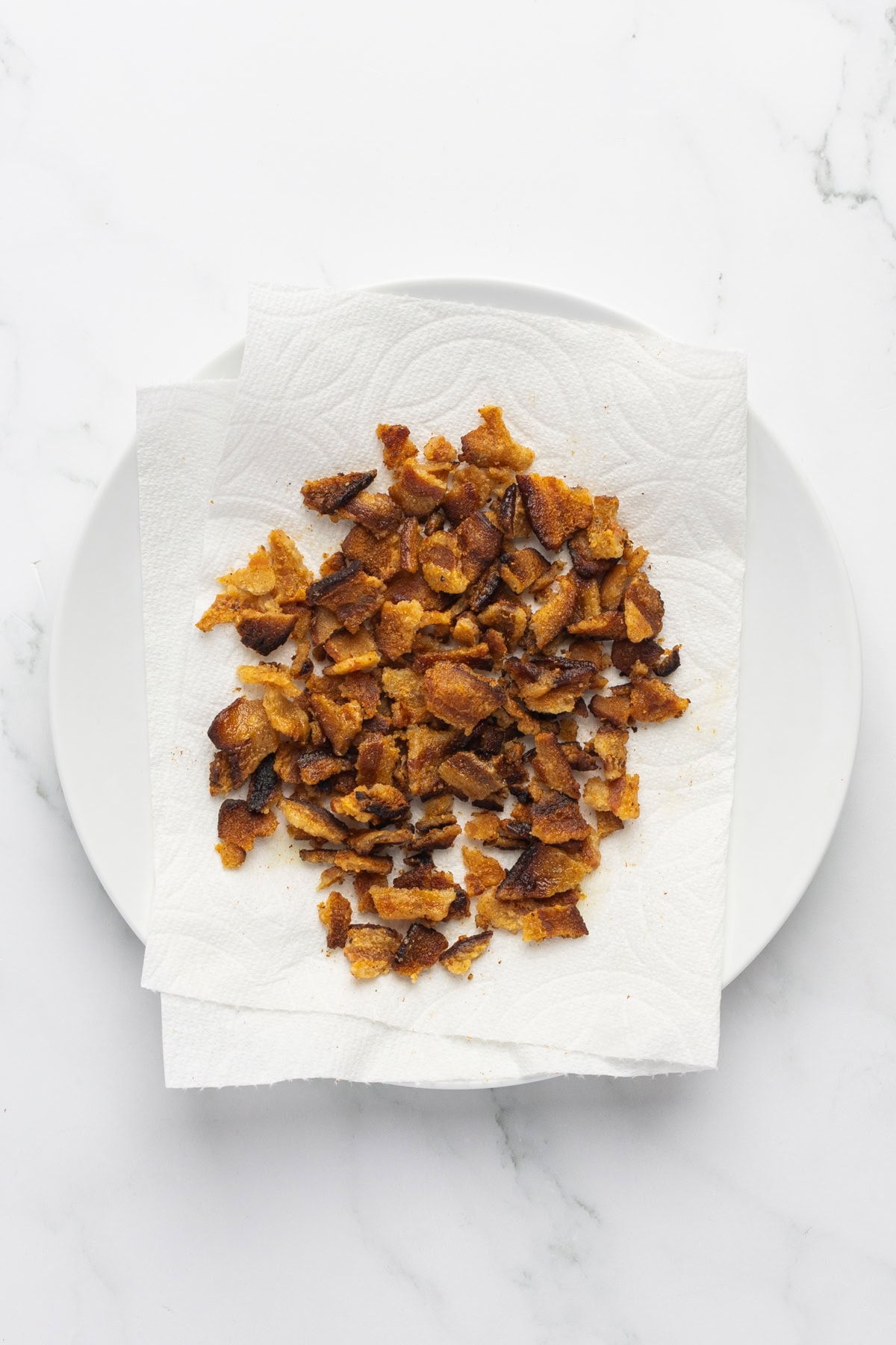 Cooked bacon on paper towels. 