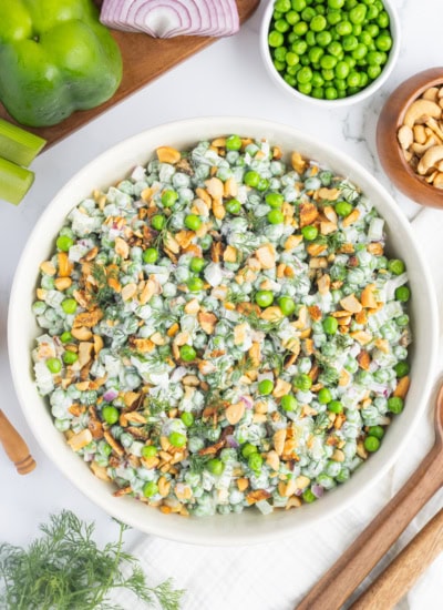 Overhead pea salad in a white bowl.