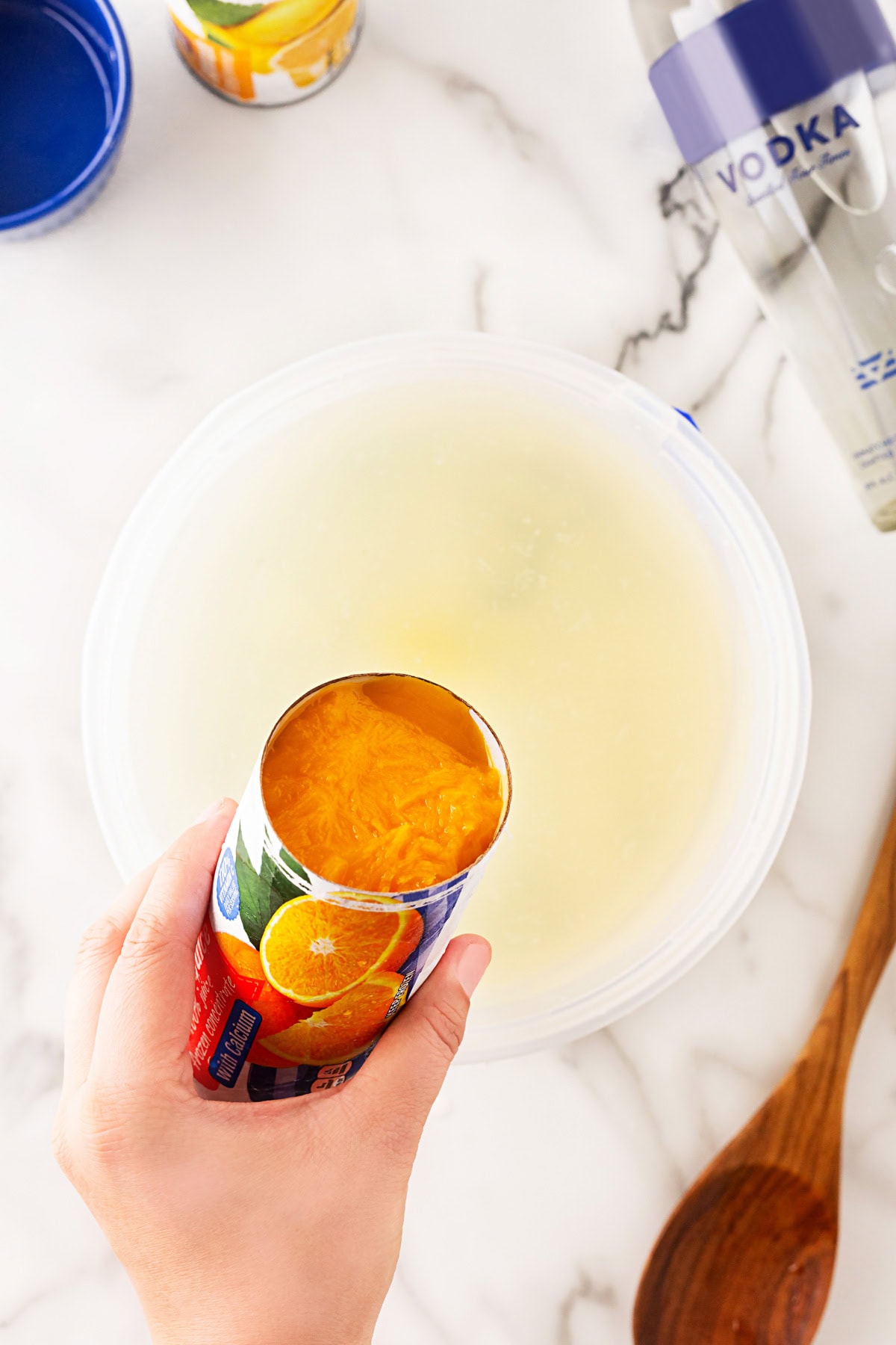 Adding in orange concentrate. 