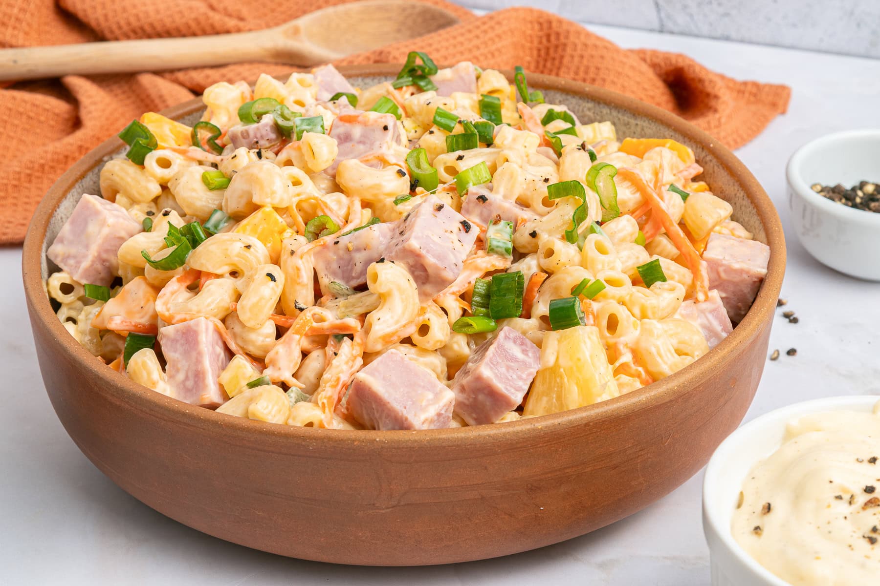This Hawaiian Macaroni Salad is easy to pull together for a BBQ, gathering, picnic or even a lunchbox. It is inspired by a mouthwatering Hawaiian pizza. Hawaiian macaroni salad served.