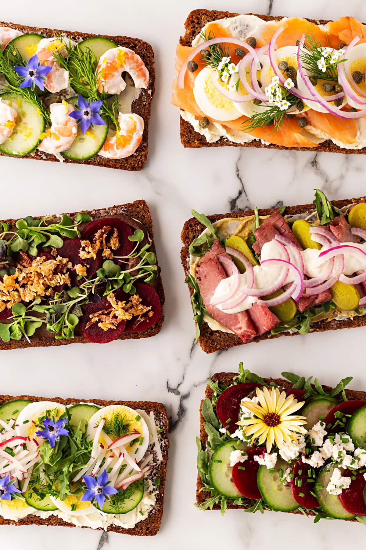 Open faced sandwiches on a counter.