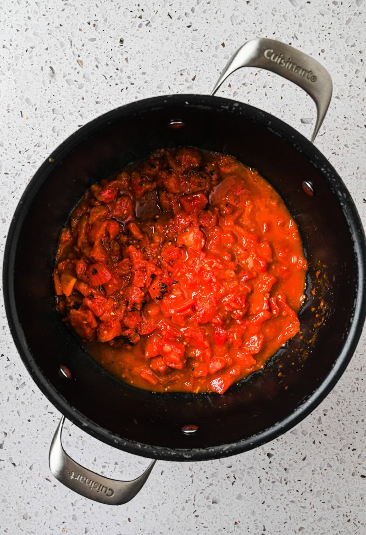 Tomatoes added to the pot. 