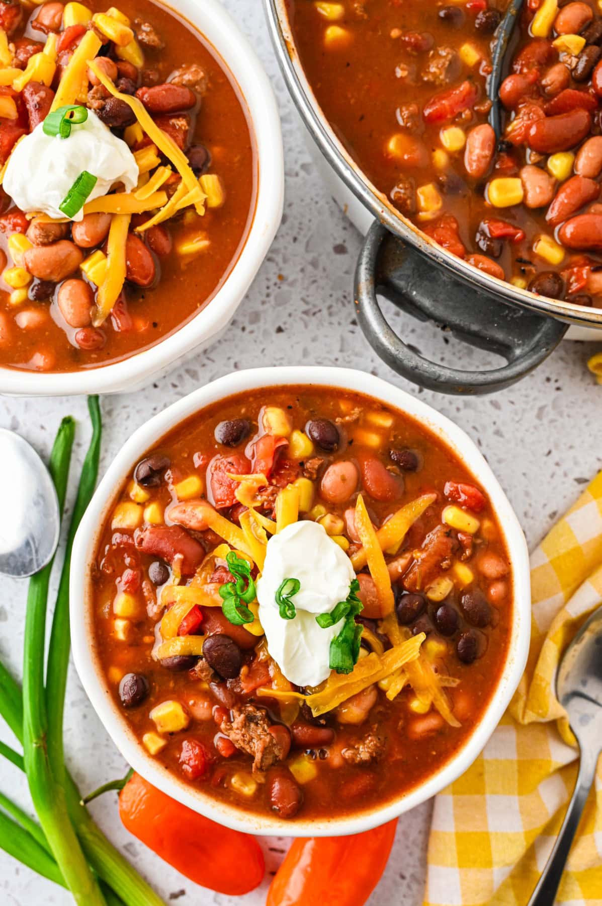 Couple of bowls of soup with the pot. 