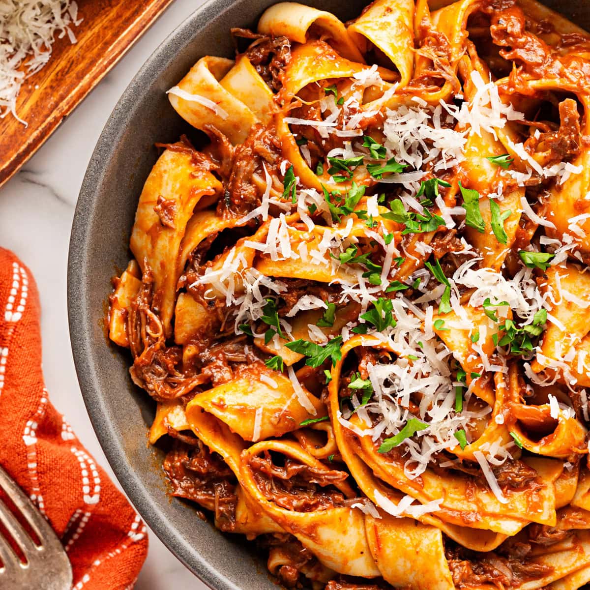 Overhead close-up of beef ragu with pappardelle. 