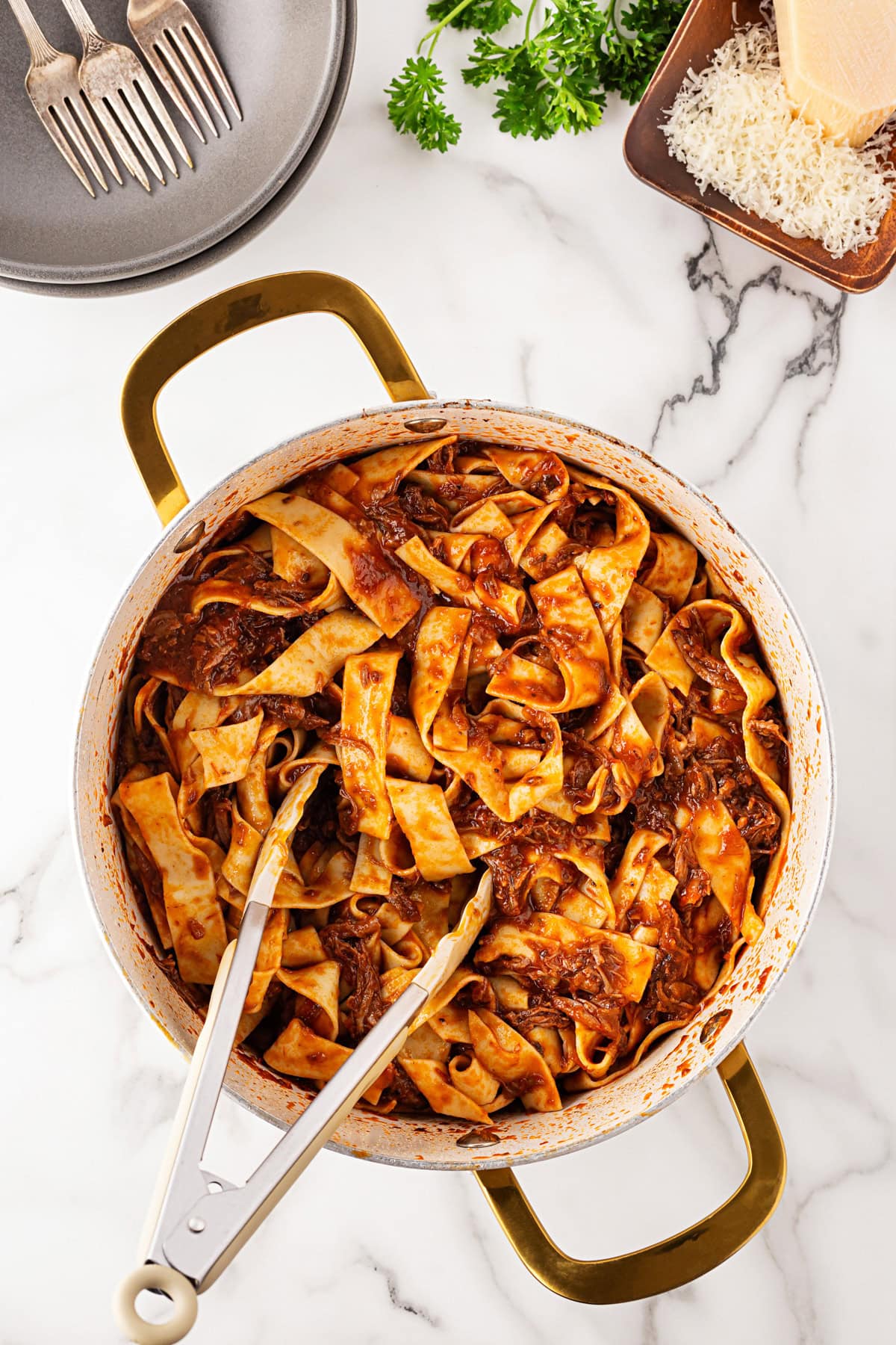 Tossing the noodles. 