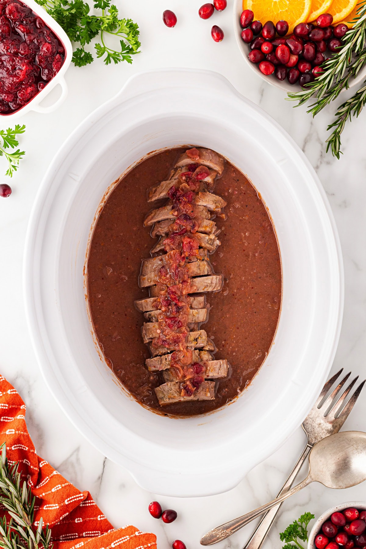 Sliced and back in the slow cooker. 