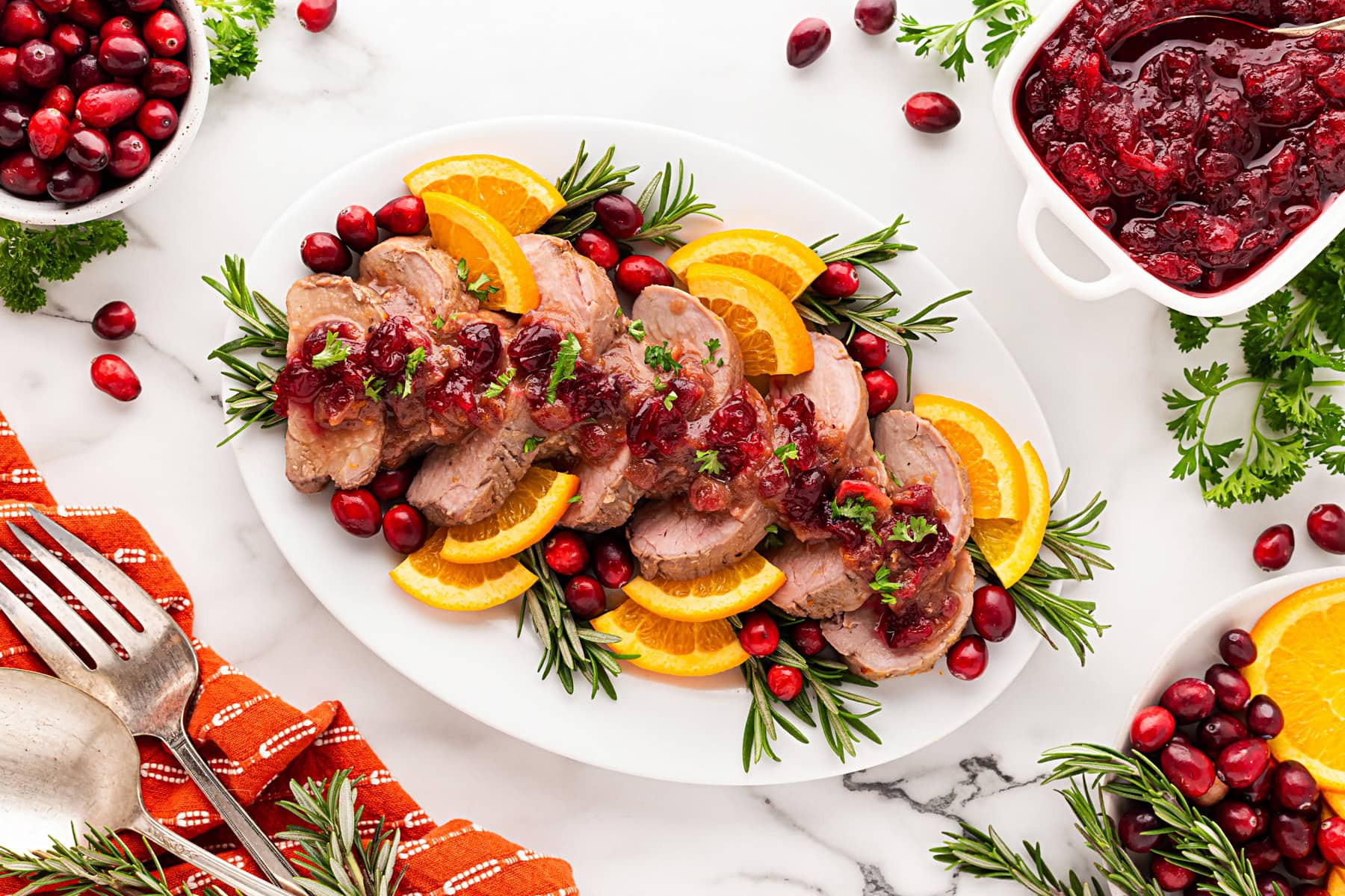 Overhead pork tenderloin on a platter. 