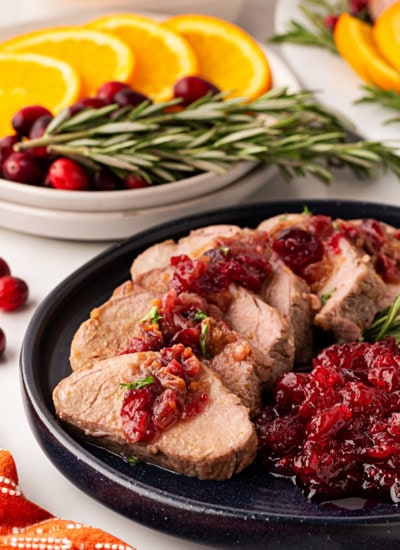Pork plated with more cranberries.