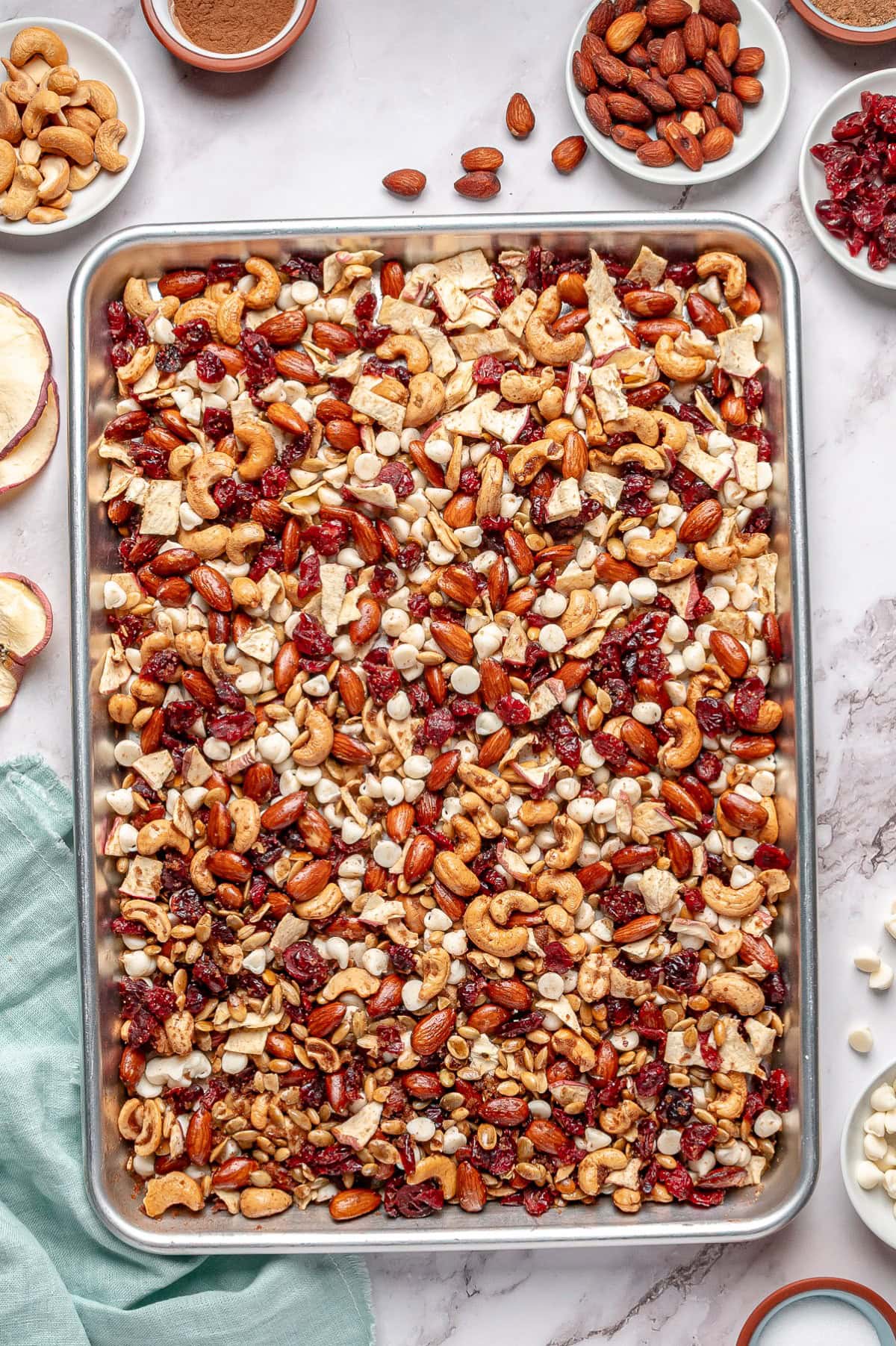 Overhead of trail mix on a baking sheet. 