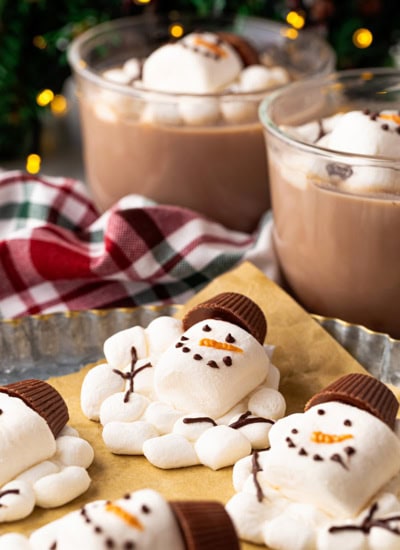 Melted Marshmallow Snowman on a baking sheet and in cocoa.