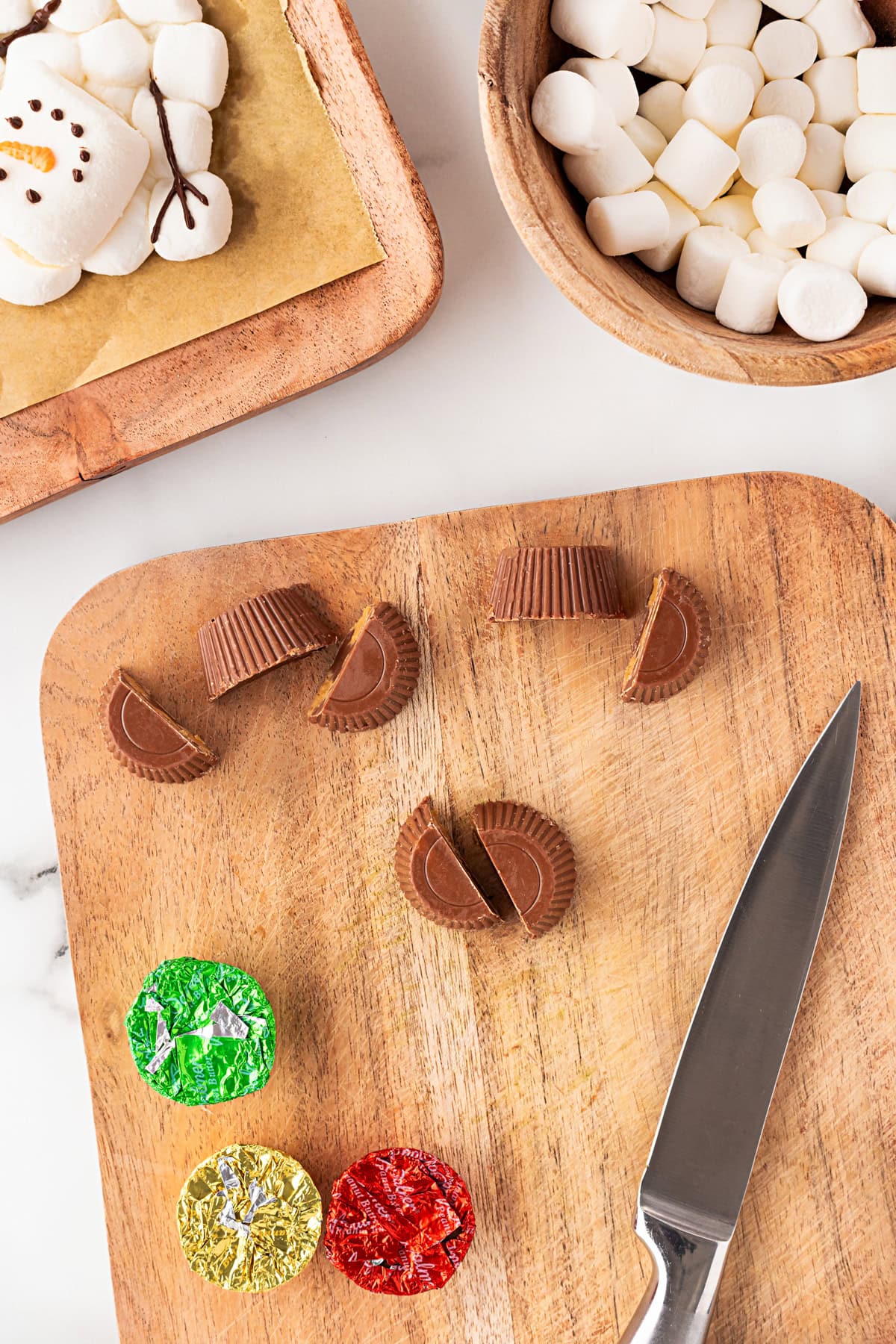 Cutting mini Reese's cups in half. 