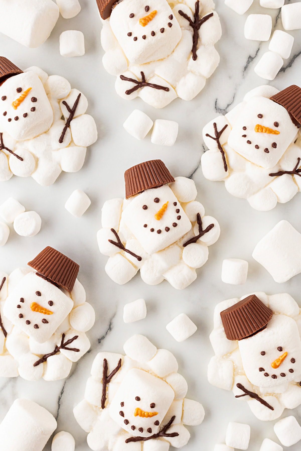 Overhead of snowman on a counter. 