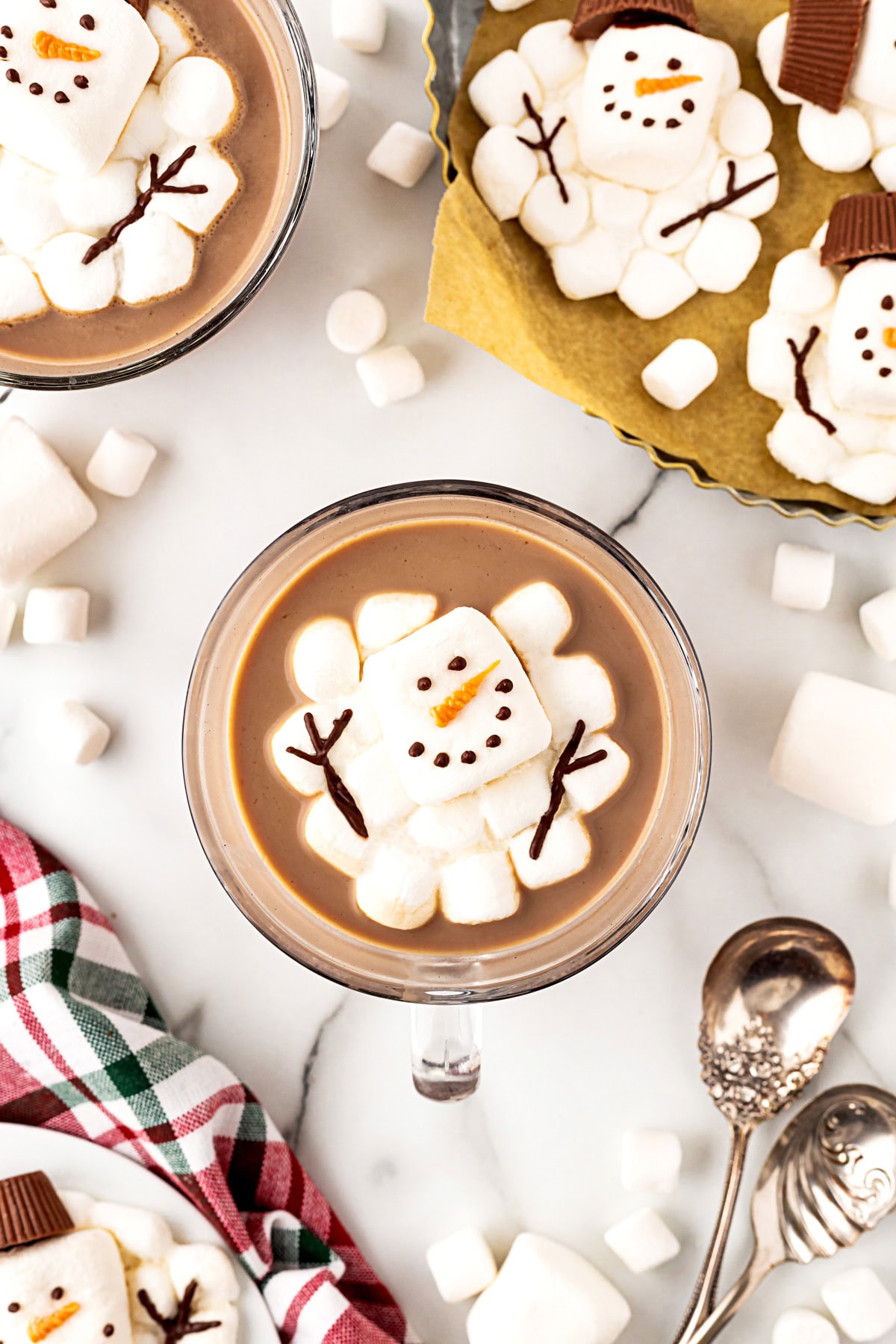 Snowman in cocoa with no hat. 