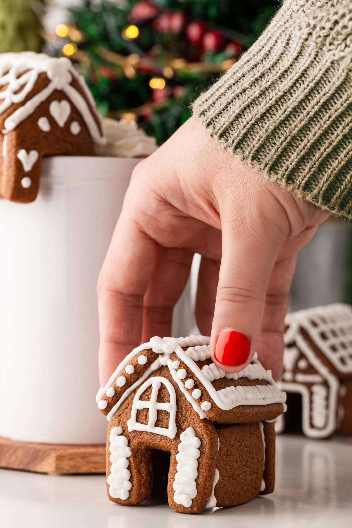 Grabbing a mini gingerbread house. 