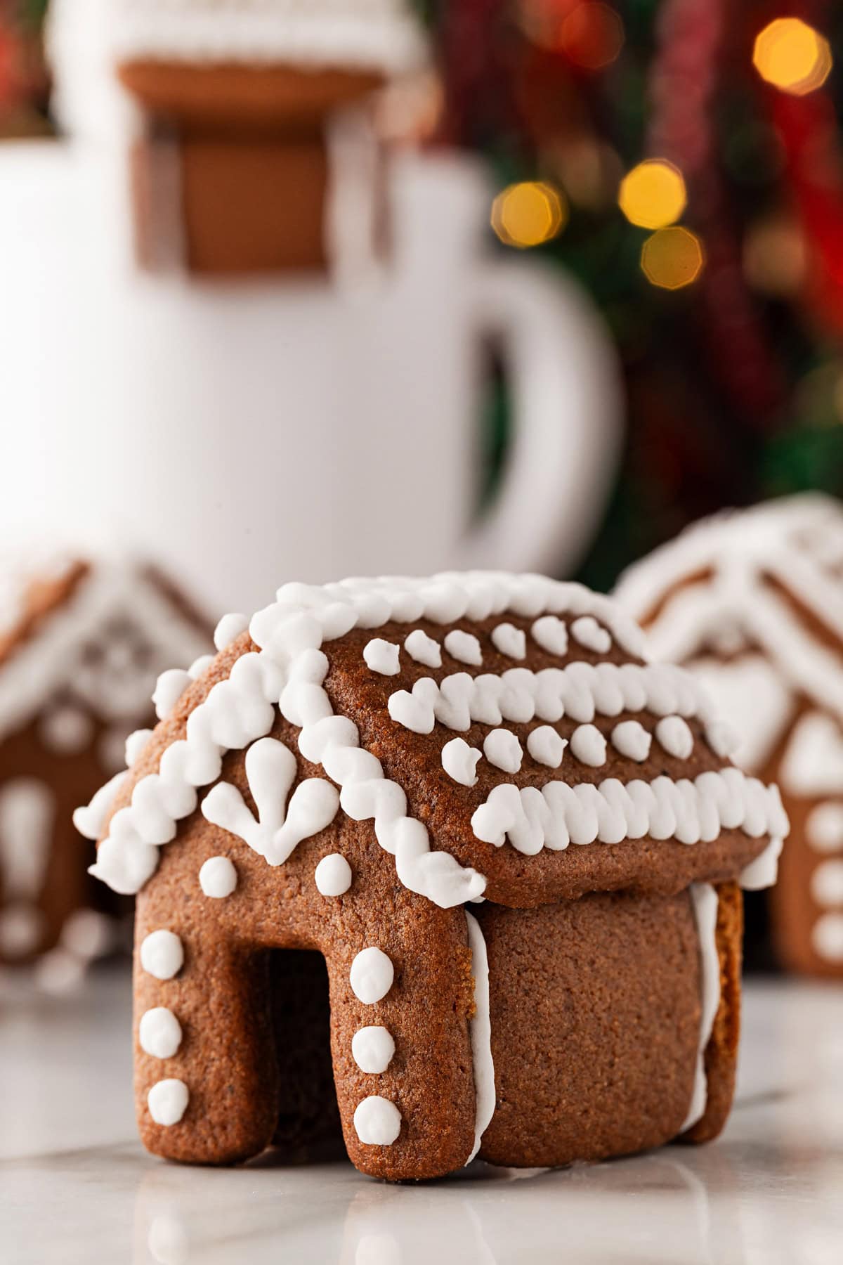 With a three pronged decoration and dots. 