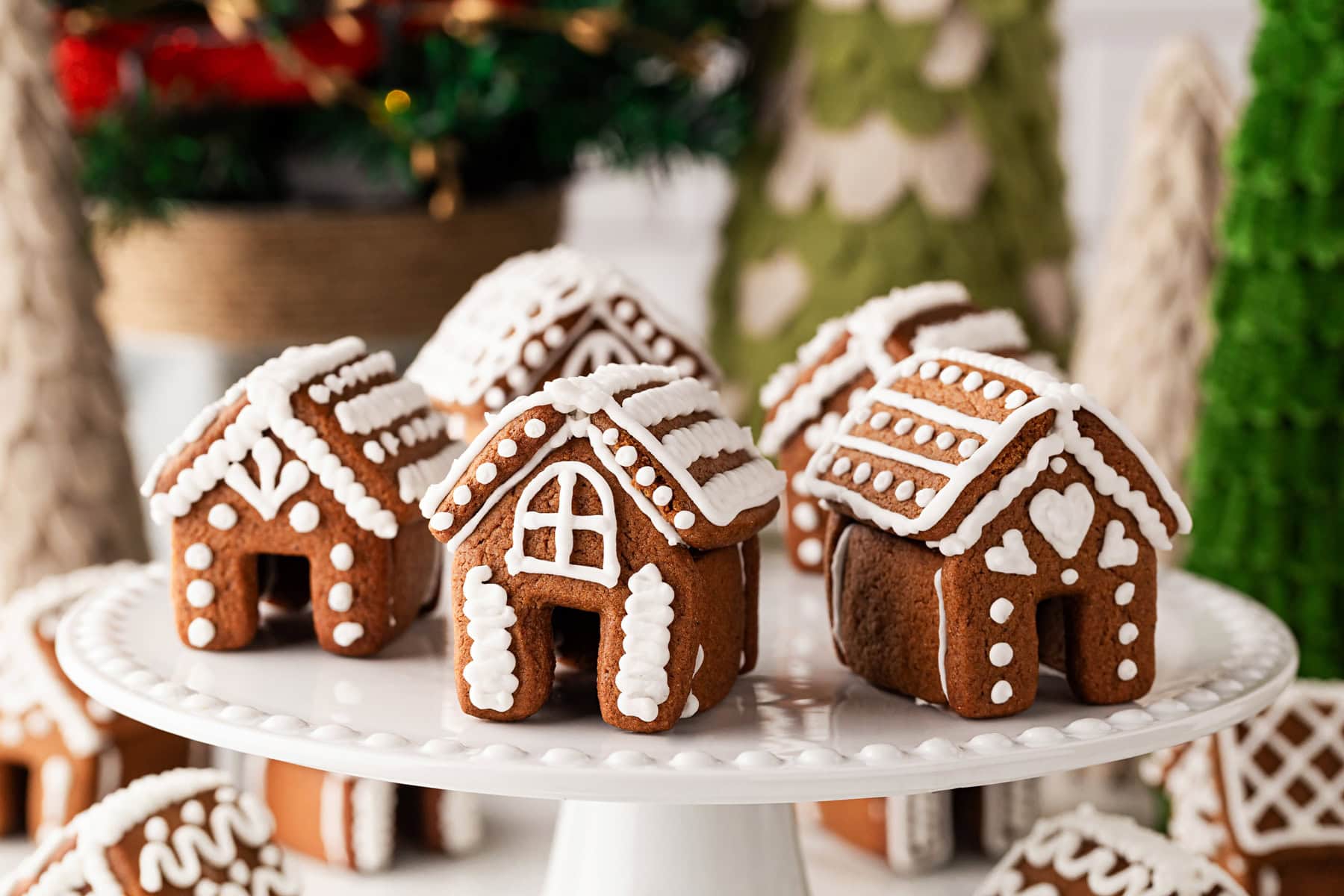 Landscape of Gingerbread Houses on a cake platter. 