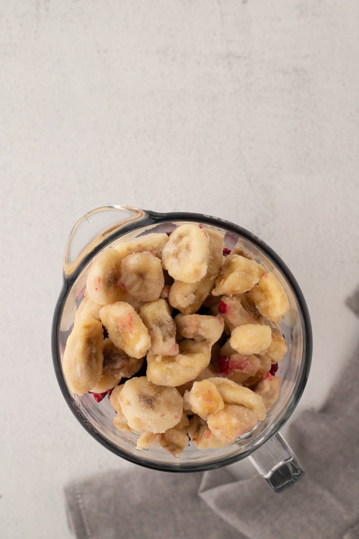Bananas and berries in blender.