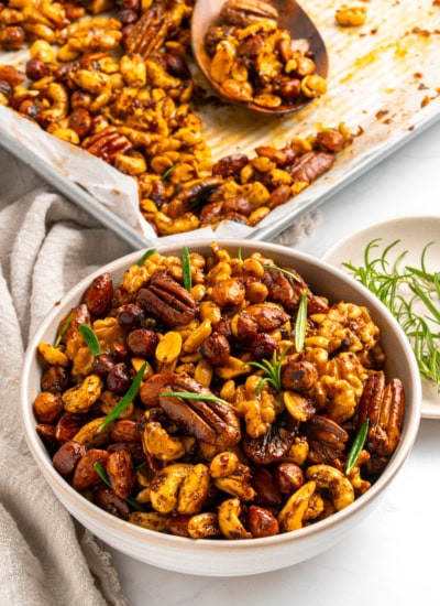 Spiced nuts from a tray to a bowl.