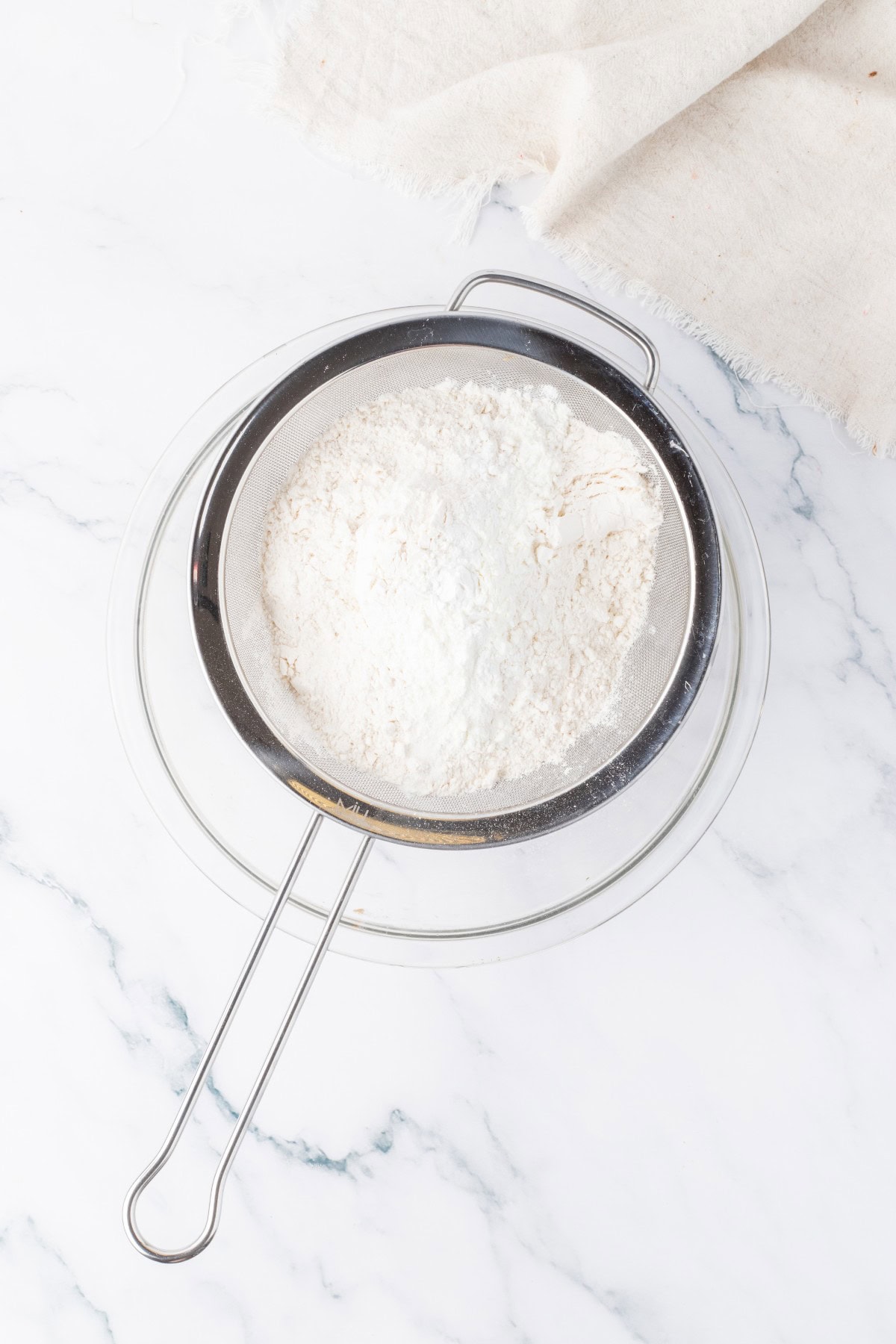 Sifting dry ingredients.