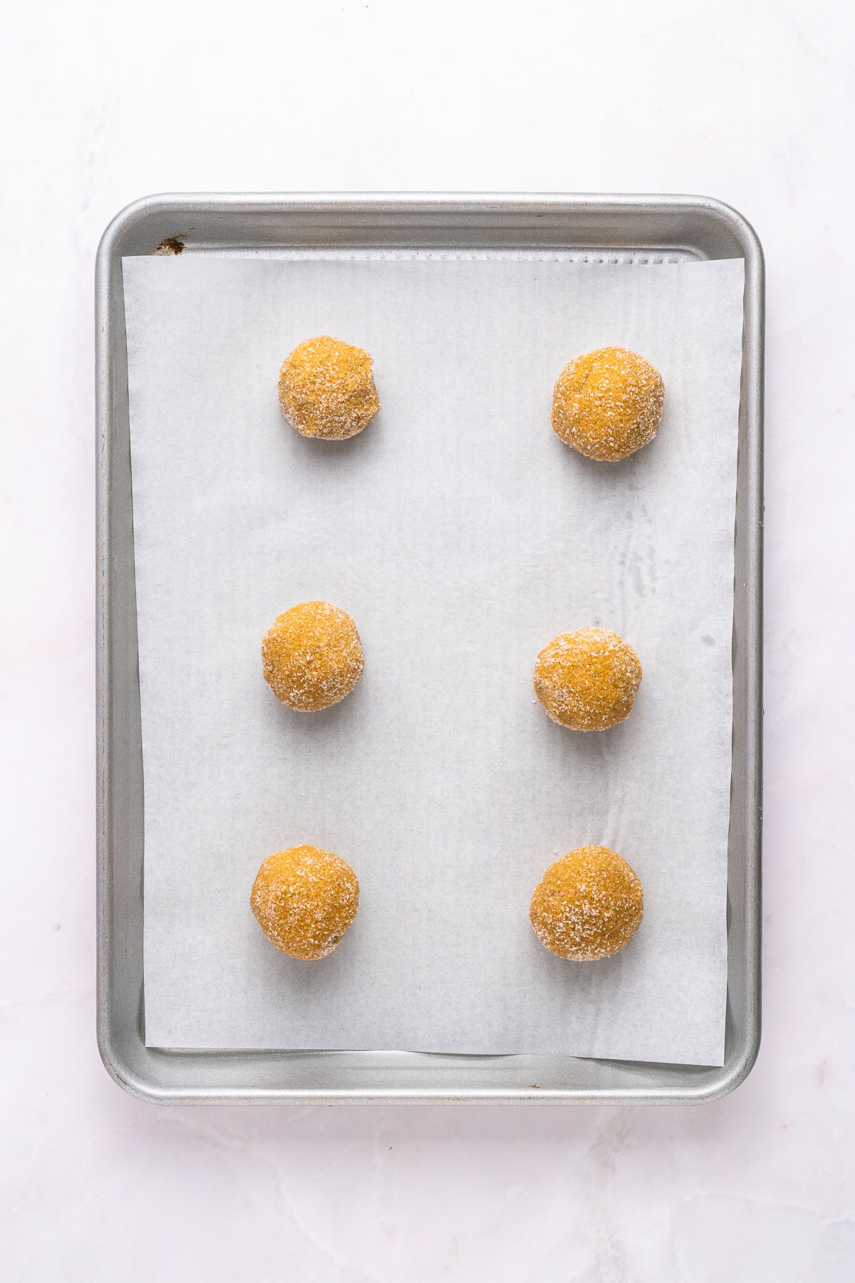 Raw cookies on a baking sheet.