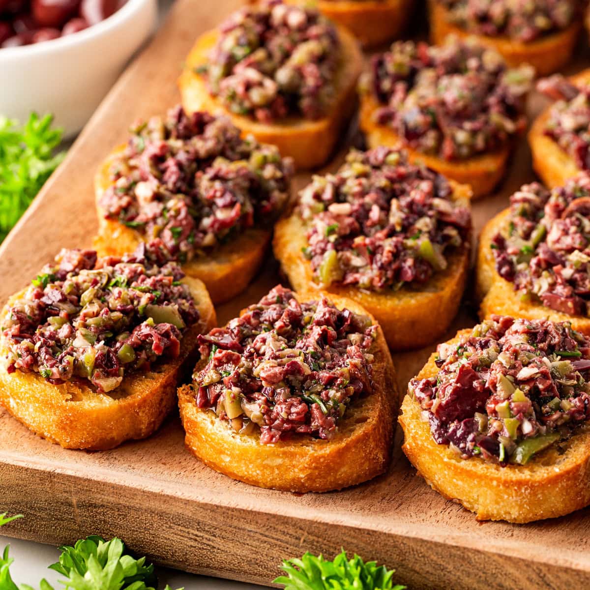 Olive Tapenade Recipe served on crostini. 