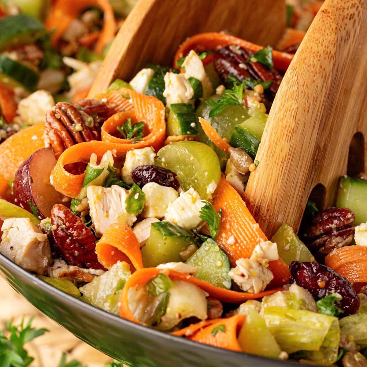 Grabbing salad with tongs. 